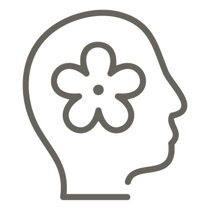 head profile with flower in place of brain icon